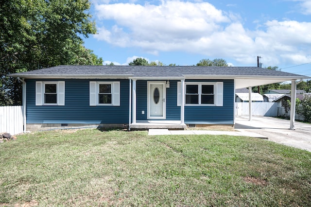 view of front of property with a front yard and a carport