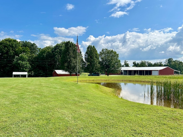 exterior space featuring a yard and a water view