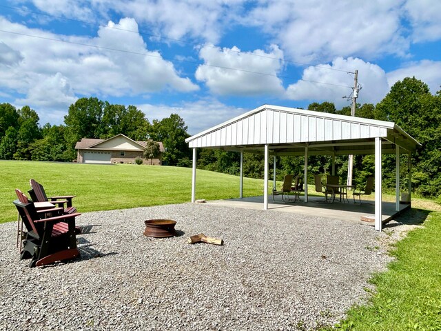 view of community featuring a patio area, a lawn, and a gazebo