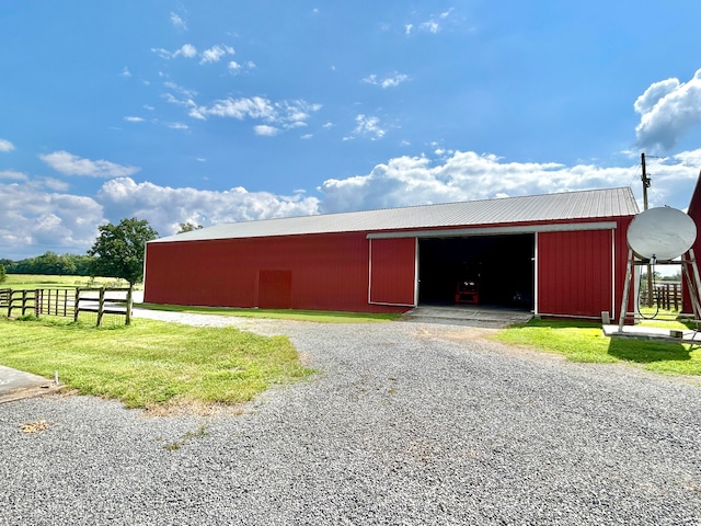 view of outbuilding featuring a yard