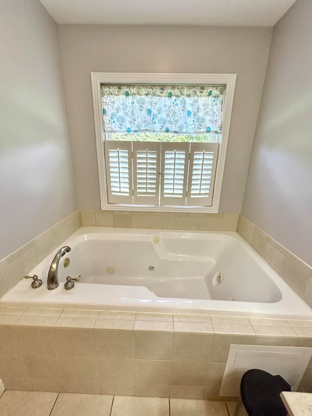 bathroom with a relaxing tiled tub