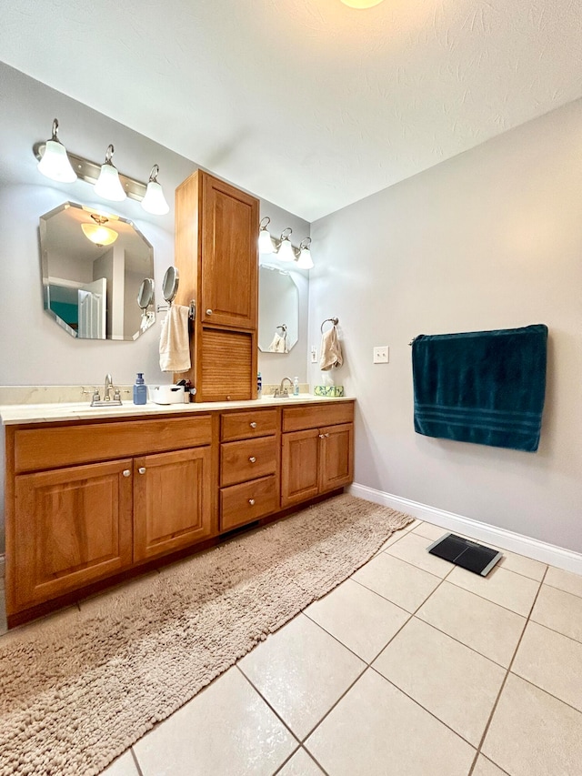 bathroom with vanity and tile patterned floors