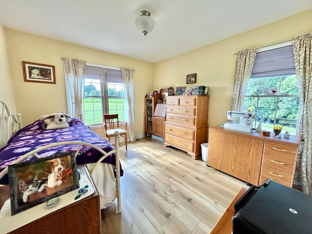 bedroom with light hardwood / wood-style floors