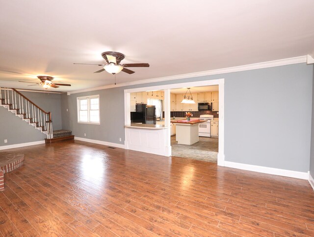 unfurnished living room with ceiling fan, light hardwood / wood-style flooring, and crown molding