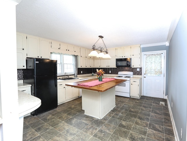 kitchen with ornamental molding, wood counters, dark tile patterned floors, a kitchen island, and black appliances