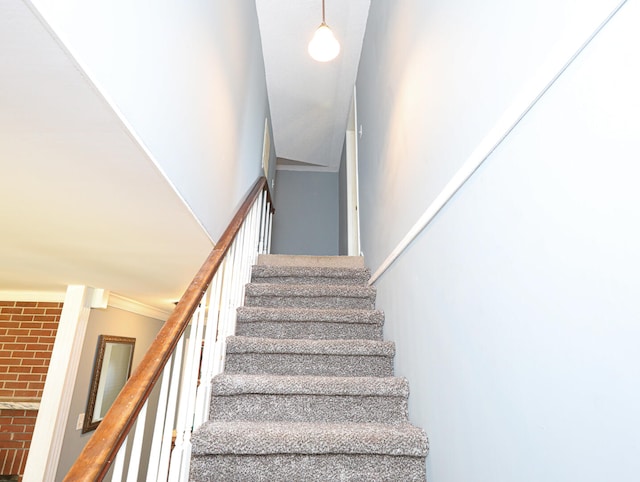 staircase with crown molding