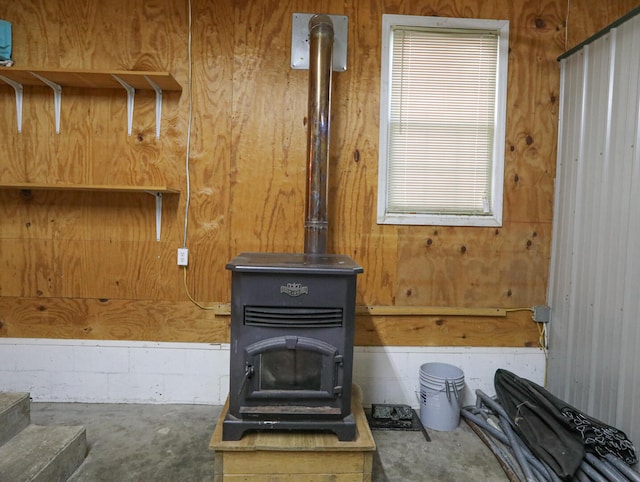 details with wood walls and a wood stove