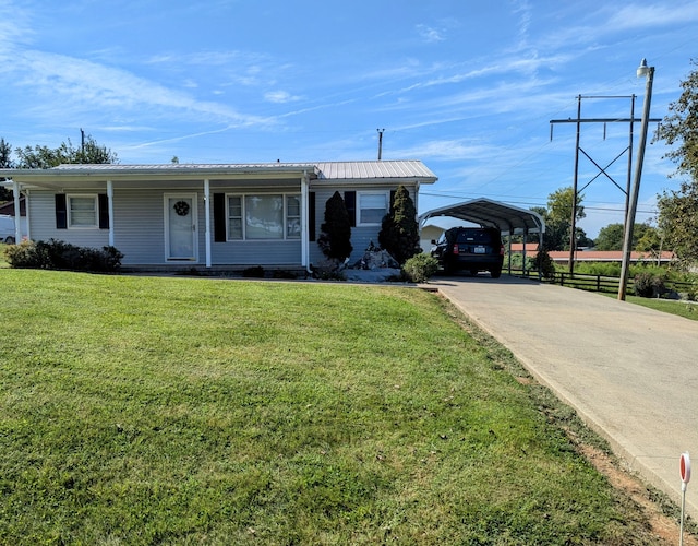 view of front facade with a carport and a front lawn