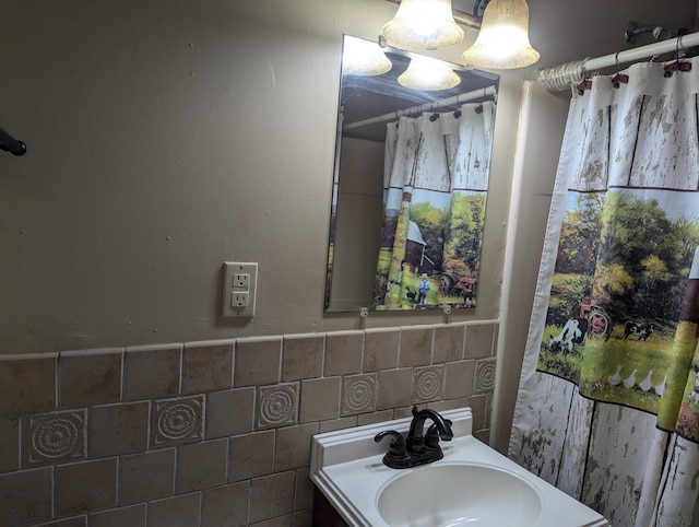 bathroom featuring tile walls and vanity