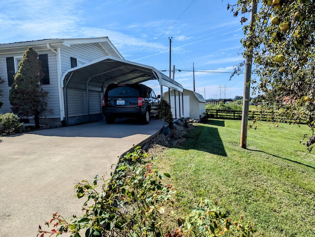 view of side of property with a yard and a carport