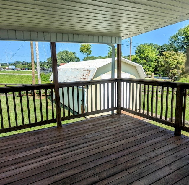 wooden deck with a lawn