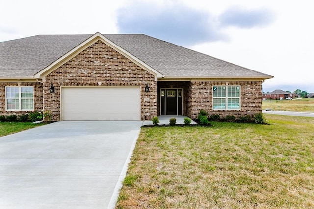 ranch-style home with a garage and a front yard