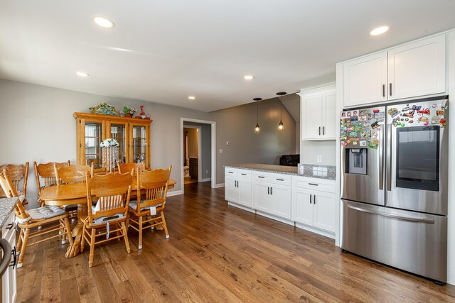 dining area featuring wood-type flooring