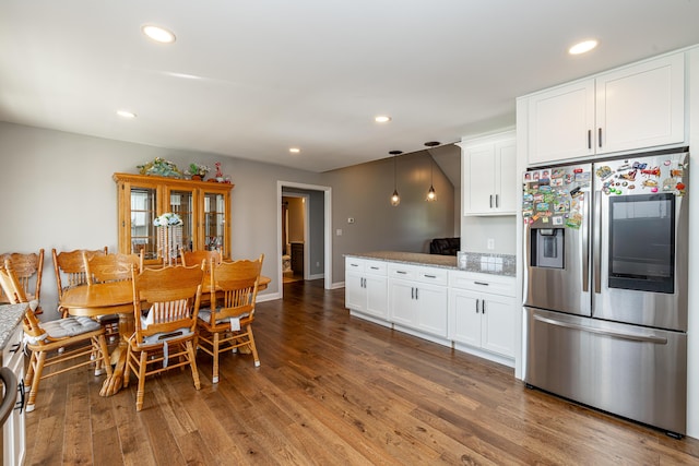 dining room featuring recessed lighting, baseboards, and wood finished floors