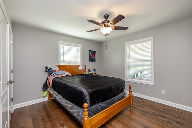 bedroom featuring ceiling fan and dark hardwood / wood-style floors