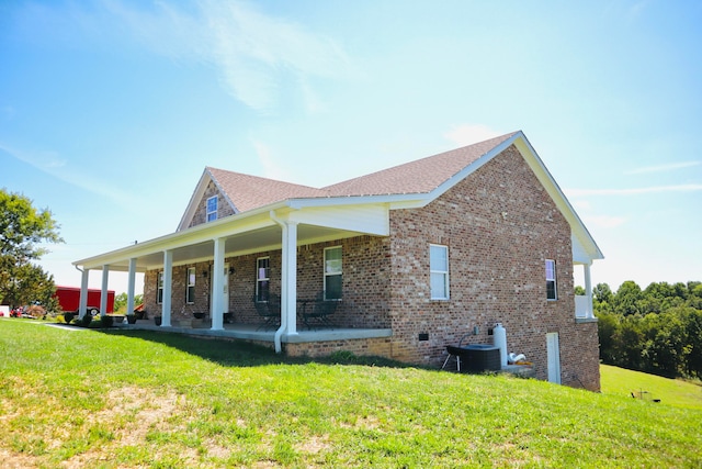 view of home's exterior with a lawn and cooling unit