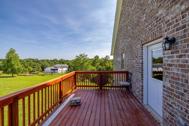 wooden deck with a yard