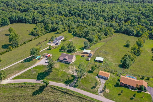 aerial view with a rural view and a view of trees