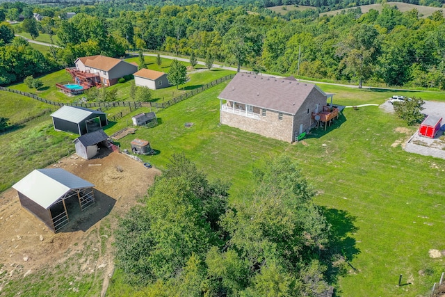 aerial view featuring a wooded view