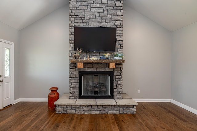 interior details with a stone fireplace, baseboards, and wood finished floors