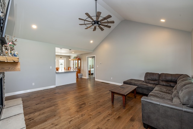 living room featuring high vaulted ceiling, ceiling fan, and dark hardwood / wood-style floors