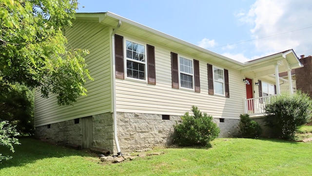 view of home's exterior featuring a yard