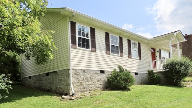 231 Hatfield St, Corbin, KY 40701 - view of property exterior with crawl space and a lawn