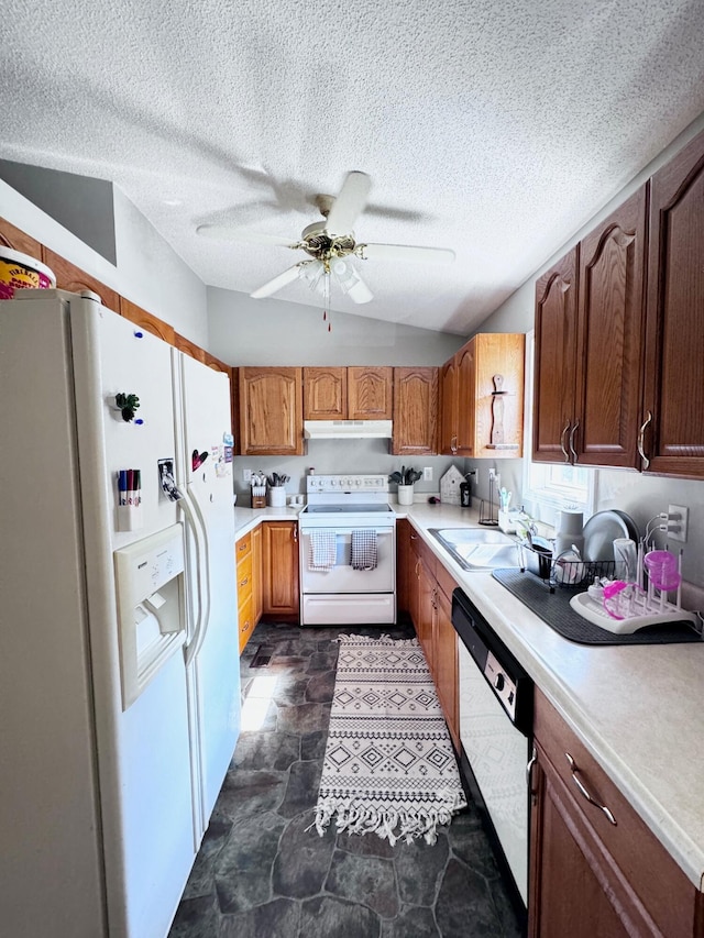 kitchen with ceiling fan, dark tile patterned flooring, a textured ceiling, and white appliances