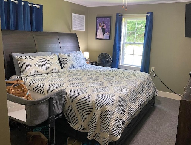 carpeted bedroom with ornamental molding