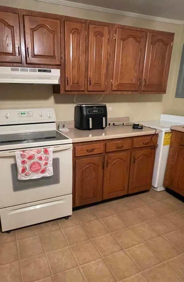 kitchen with crown molding, light tile patterned floors, and white electric range oven