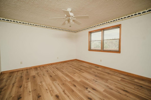 8594 Morehead Rd, Flemingsburg, KY 41041 - unfurnished room featuring a textured ceiling, baseboards, and wood finished floors