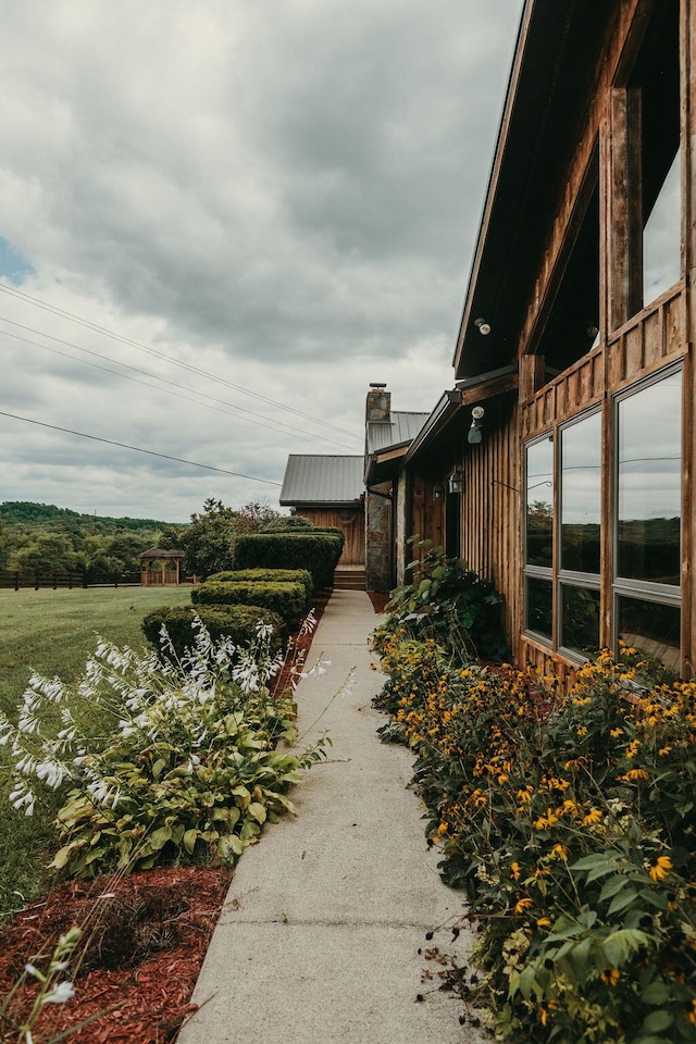 8594 Morehead Rd, Flemingsburg, KY 41041 - view of side of home with metal roof and a chimney