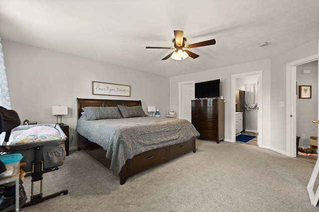 carpeted bedroom featuring ceiling fan and ensuite bathroom