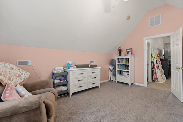 sitting room with light carpet and vaulted ceiling