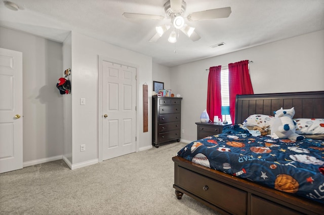 carpeted bedroom featuring ceiling fan