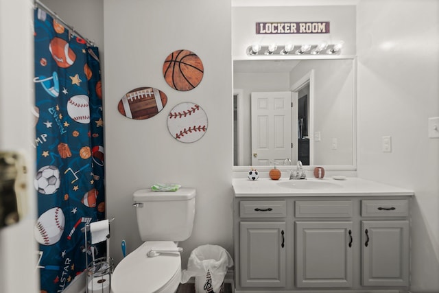 bathroom featuring toilet and vanity