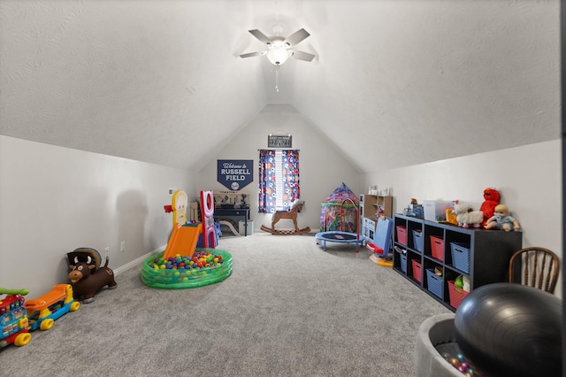 game room featuring carpet floors, ceiling fan, a textured ceiling, and lofted ceiling