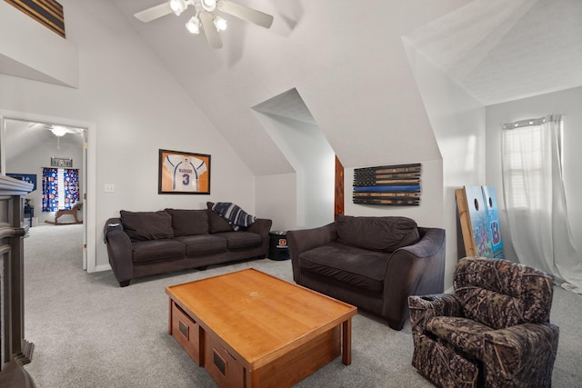 living room with carpet flooring, ceiling fan, and vaulted ceiling