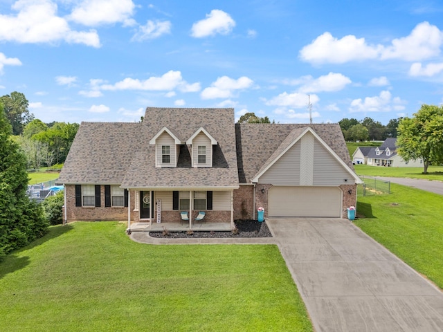 view of front of property featuring a front lawn and a garage