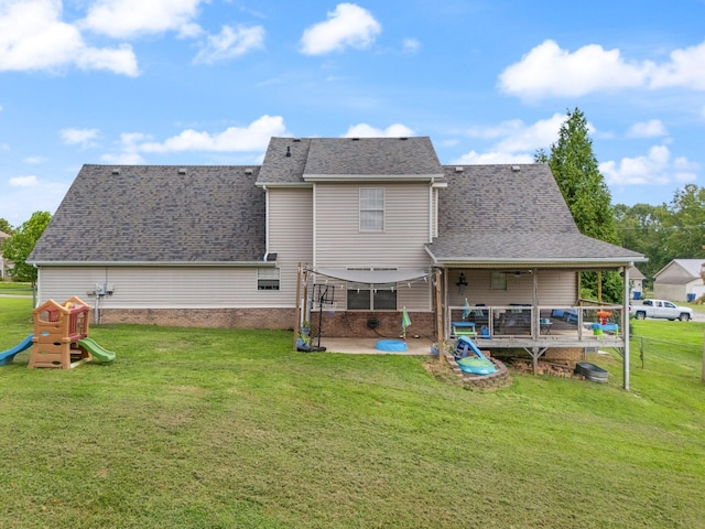 back of property featuring a yard