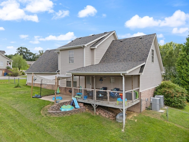 back of house with a lawn, cooling unit, and a deck