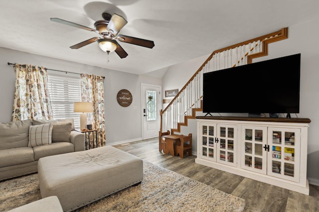 living room featuring ceiling fan and hardwood / wood-style floors