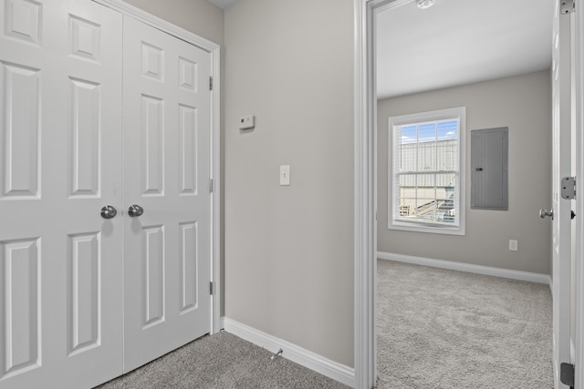 interior space with electric panel and baseboards