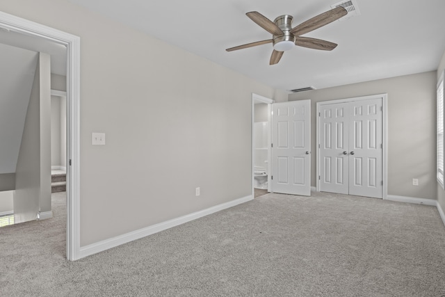 unfurnished bedroom featuring carpet, a closet, visible vents, and baseboards