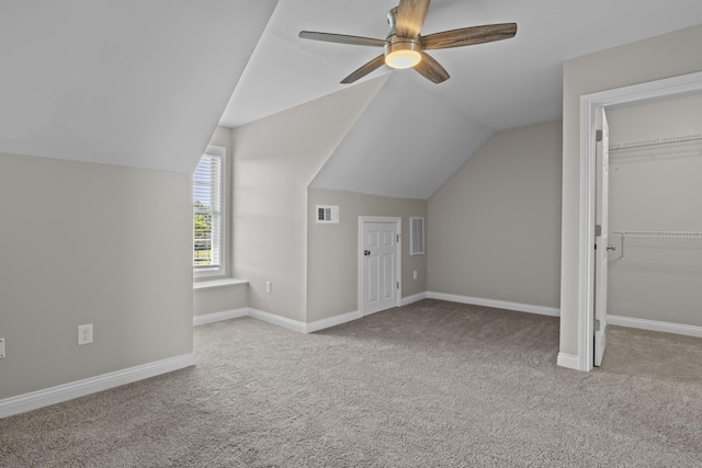 bonus room with carpet, visible vents, and baseboards