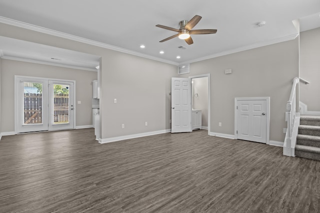 unfurnished living room with ceiling fan, dark wood-type flooring, baseboards, stairway, and crown molding