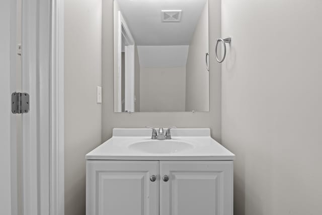 bathroom with visible vents and vanity