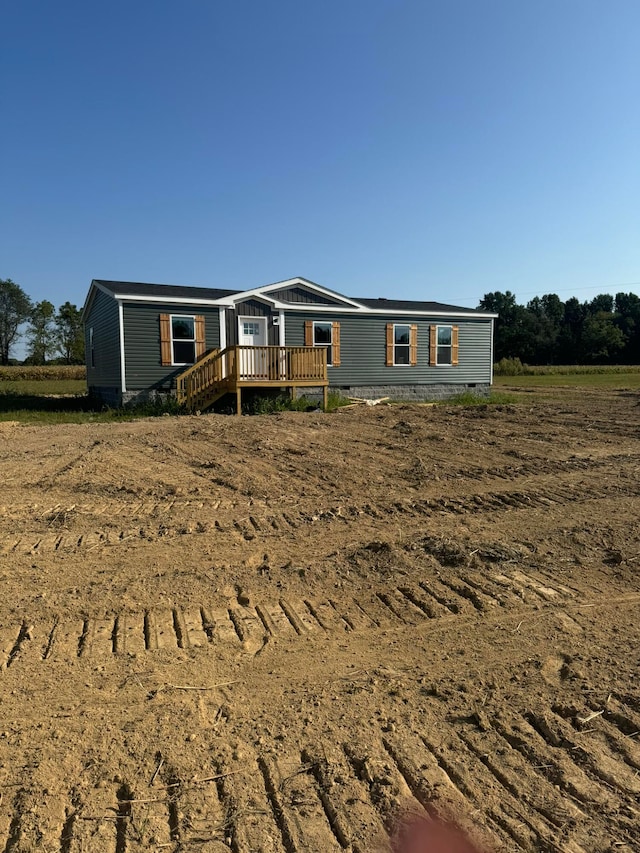 manufactured / mobile home with a wooden deck