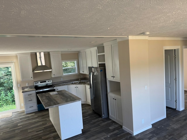 kitchen featuring a kitchen island, dark hardwood / wood-style floors, wall chimney exhaust hood, appliances with stainless steel finishes, and white cabinetry