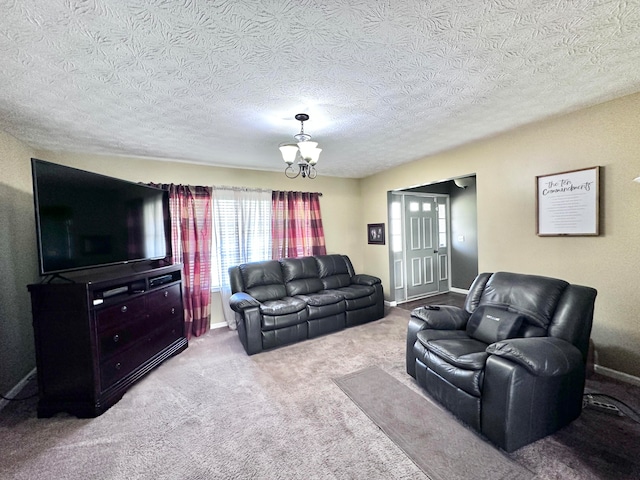 carpeted living room with a textured ceiling and a chandelier